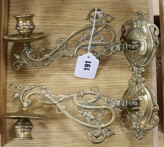 A pair of Art Nouveau brass sconces